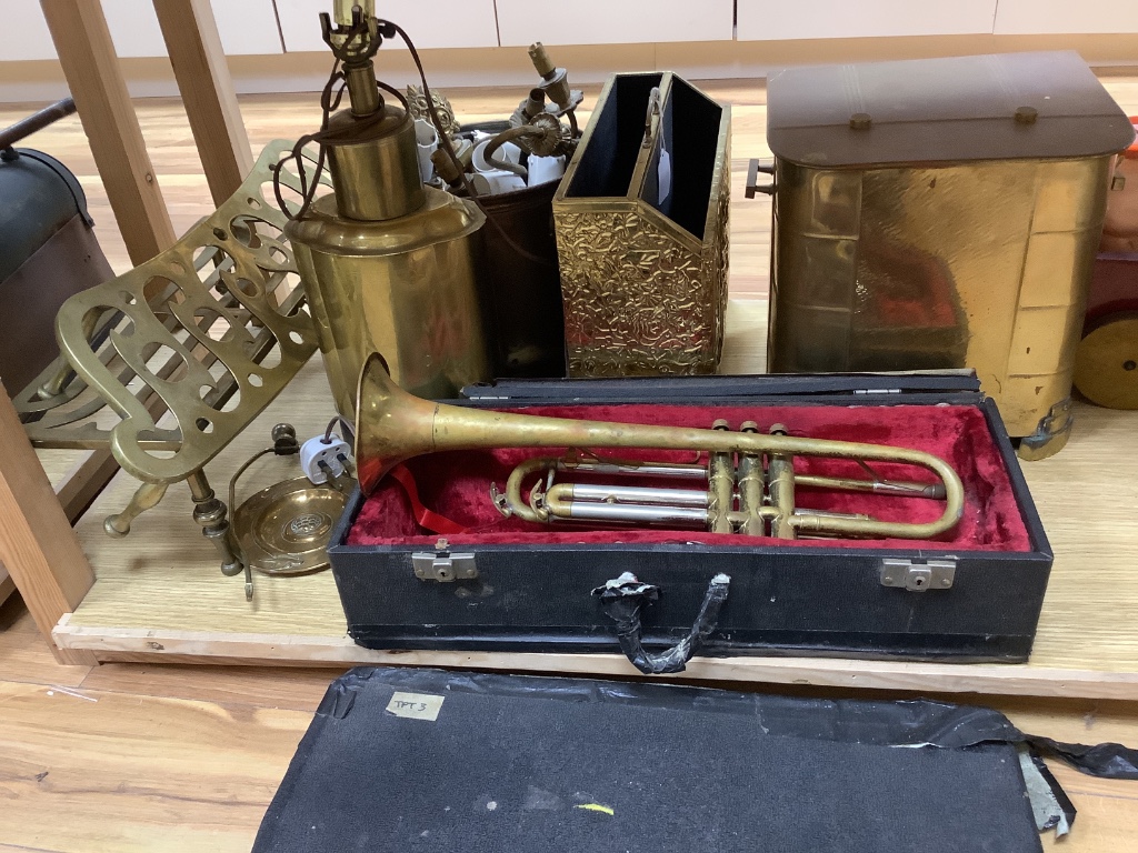 A quantity of mixed brass including a coal scuttle, trivets, a jardiniere, lighting and a trumpet, etc.